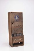 A vintage Player's coin operated cigarette dispenser