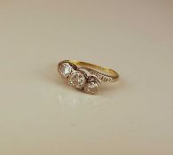 A graduated three stone diamond ring