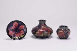 Two Moorcroft 'Finches' vases and an 'Anemone' coaster