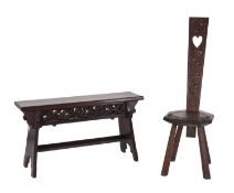 A carved oak stool and a spinner's chair