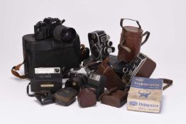 A collection of roll film cameras and accessories