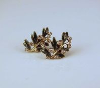 A pair of rose cut diamond and enamel earrings