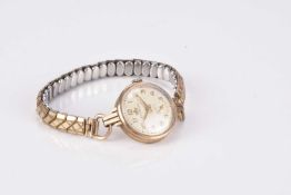 Two lady's 9ct gold bracelet watches and a 9ct gold brooch