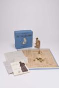 A group of toys and figures, with some Beatrix Potter interest