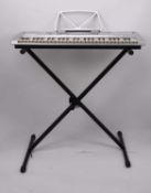 An Acoustic Solutions MK-2054 electric keyboard with stand