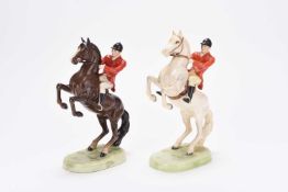 A pair of Beswick Huntsmen on rearing horses, model 868