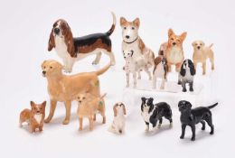 A collection of Beswick dogs and two Sylvac dogs