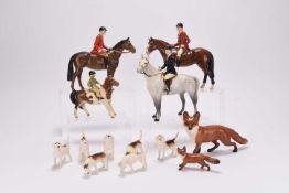 A Beswick Hunting set including riders, foxes and hounds