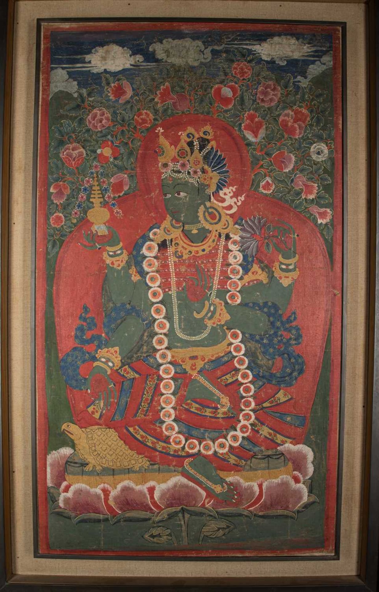 A PAINTING OF GREEN TARA ON A TORTOISE THRONE