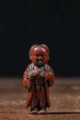 (R) NETSUKE OF A BOY HOLDING A TORTOISE