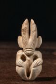 A HONGSHAN JADE FIGURE, NORTHEAST CHINA CIRCA 3500–3000 BCE