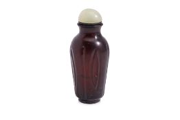 A DARK AMBER GLASS SNUFF BOTTLE