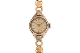 A SOLAR GOLD PLATED WATCH ON GOLD BRACELET