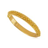 A HIGH KARAT GOLD BANGLE