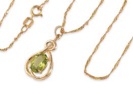 A PERIDOT PENDANT ON AN ITALIAN CHAIN