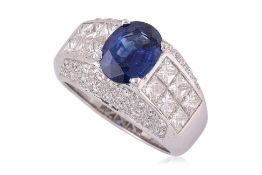 A VIVID BLUE SAPPHIRE AND DIAMOND RING