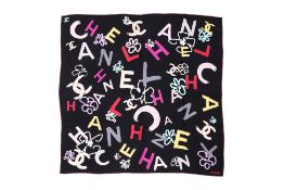 A CHANEL ALL OVER SPELLOUT PRINT SCARF