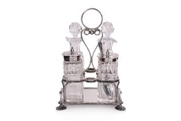 A LATE VICTORIAN ENGLISH SILVER AND CUT GLASS CRUET SET