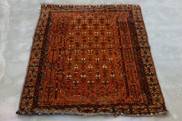 A TRIBAL WOOL RUG (180x130cm)