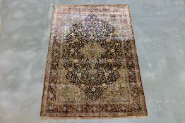 A SMALL FINELY KNOTTED SILK RUG (146 x 90cm)