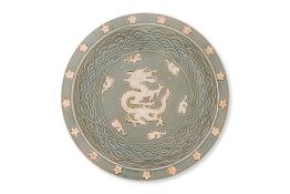 A LARGE BISCUIT DECORATED CELADON GROUND DRAGON DISH