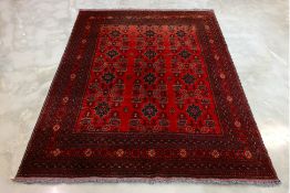 A TURKOMAN WOOL CARPET (290 x 207cm)