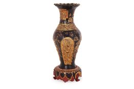 A GILT AND LACQUERED WOODEN VASE