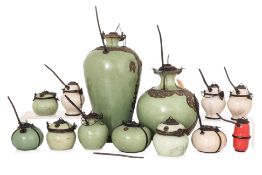A GROUP OF SOUTHEAST ASIAN METAL MOUNTED CERAMIC WATER POTS