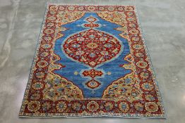 A TURKISH SAMSUN WOOL RUG (200 x 142cm)