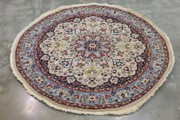 A CIRCULAR MEDALION WOOL RUG (190cm DIAM)