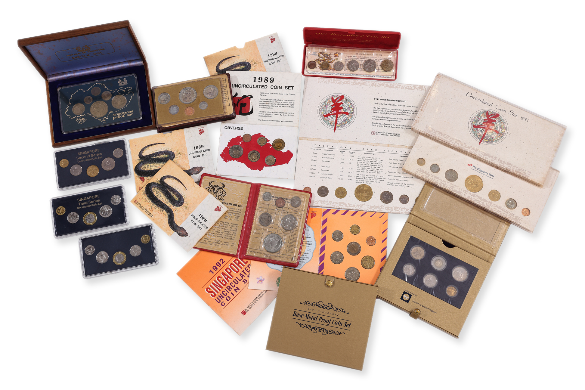A GROUP OF 16 SINGAPORE UNC COIN SETS
