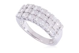 A THREE ROW DIAMOND RING