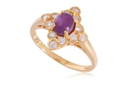 A HIGH KARAT GOLD STAR RUBY AND DIAMOND RING