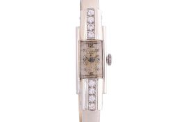 A BAUME & MERCIER LADIES WHITE GOLD AND DIAMOND WATCH