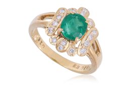 AN EMERALD AND DIAMOND RING