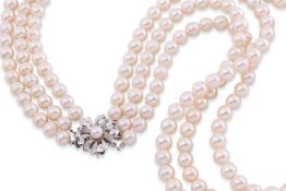 A THREE STRAND AKOYA PEARL NECKLACE