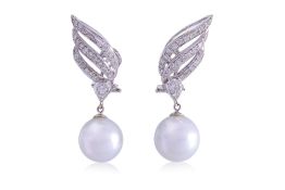 A PAIR OF SOUTH SEA CULTURED PEARL AND DIAMOND 'WINGS' EARRINGS