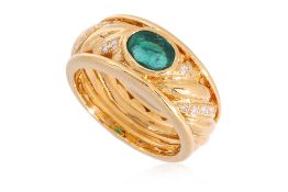A BEZEL SET EMERALD AND DIAMOND RING