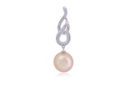 A SOUTH SEA CULTURED PEARL AND DIAMOND PENDANT