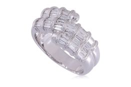 A TAPERED BAGUETTE DIAMOND RING