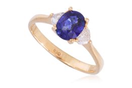 A HIGH KARAT GOLD SAPPHIRE AND DIAMOND RING