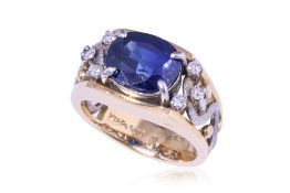 A SAPPHIRE AND DIAMOND TWO TONE RING