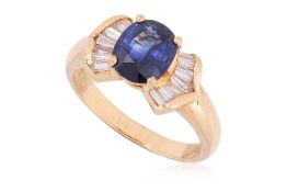 A HIGH KARAT GOLD SAPPHIRE AND DIAMOND RING