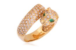 AN EMERALD AND DIAMOND 'CROSSOVER' RING