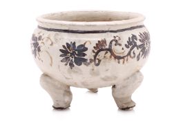 A CIZHOU WHITE-GLAZED AND PAINTED TRIPOD CENSER
