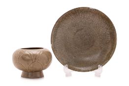 A CRACKLED CELADON DISH AND A GREEN-GLAZED LOTUS JAR