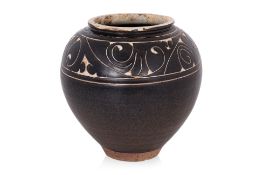 A CARVED CIZHOU BLACK-GLAZED JAR