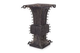 A LARGE ARCHAISTIC BRONZE GU FORM VASE
