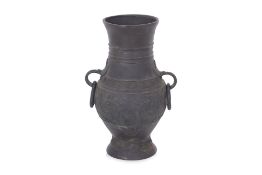 AN ARCHAISTIC BRONZE HU FORM VASE