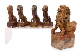 A GROUP OF FIVE AMBER GLAZED FOO LION FIGURES